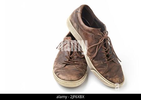 Beautifully aged vintage brown leather boots isolated on white background. Front view Stock Photo