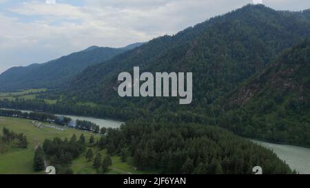 Mountains of Altai beside of Katun river at during daytime, Altai, Siberia, Russia. Beautiful summer nature landscape at during daytime. Aerial view f Stock Photo