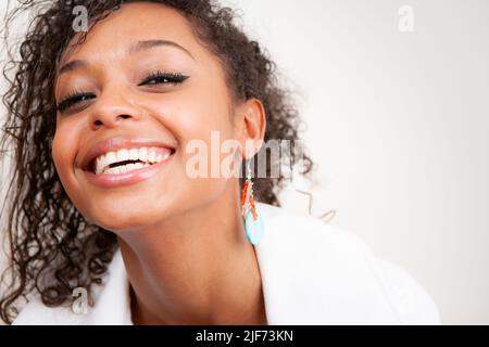 Natural Laughter. A spontaneous laugh from a beautiful young female model. From a series of images with the same models. Stock Photo