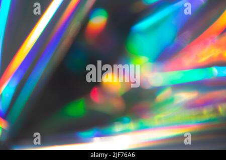 Rainbow holographic bokeh background. Multicolored overflows of color. Stock Photo