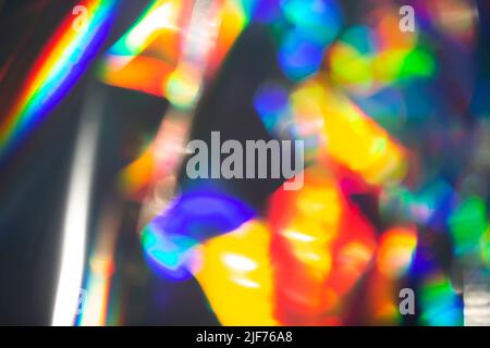 Rainbow holographic bokeh background. Multicolored overflows of color. Stock Photo