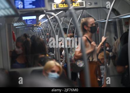 30 June 2022, Hessen, Frankfurt/Main: Train passengers are on an S-Bahn train at the main station. For 9 euros a month throughout Germany - this offer has convinced many people. Initial data even suggest that car drivers are also benefiting from it. Photo: Arne Dedert/dpa Stock Photo