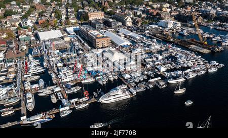 Aerial stock photos of the Newport Harbor, boats docked and moored in late afternoon sun at the Newport International Boat Show, Safe Harbor Shipyard. Stock Photo