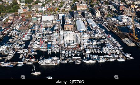 Aerial stock photos of the Newport Harbor, boats docked and moored in late afternoon sun at the Newport International Boat Show, Safe Harbor Shipyard. Stock Photo