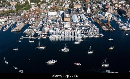 Aerial stock photos of the Newport Harbor, boats docked and moored in late afternoon sun at the Newport International Boat Show, Safe Harbor Shipyard. Stock Photo