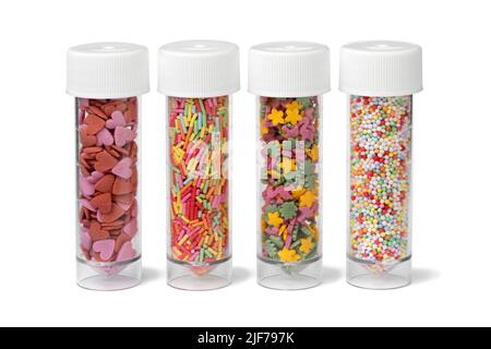 Plastic tubes with colorful sugar sprinkles to decorate homemade pastry isolated on white background Stock Photo