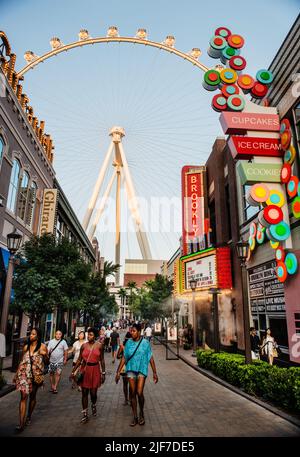 The Las Vegas Ferris wheel surrounded by shops and hotels, Las Vegas Strip, Las Vegas Nevada Stock Photo