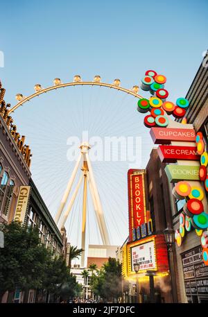 The Las Vegas Ferris wheel surrounded by shops and hotels, Las Vegas Strip, Las Vegas Nevada Stock Photo