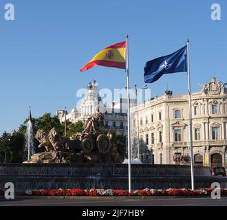 Madrid, Spain. 28th June, 2022. The North Atlantic Treaty Organization (NATO) flag and Spanish national flag are seen in Madrid, Spain, June 28, 2022. Credit: Meng Dingbo/Xinhua/Alamy Live News Stock Photo