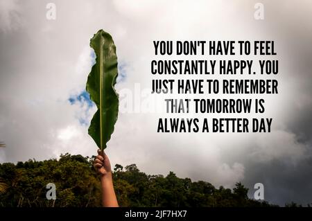 Motivational text - You do not have to feel constantly happy. You just have to remember that tomorrow is always a better day. Motivational concept Stock Photo