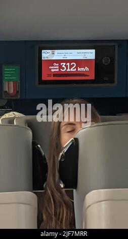 Interior of a TGV train with screen showing the speed of travel as 312 kph Stock Photo