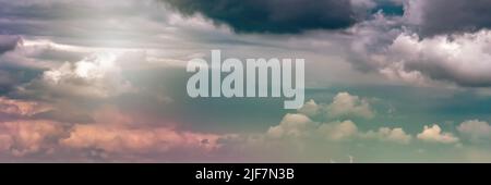 Dramatic sky with dark clouds over a field, dark clouds before rain Stock Photo