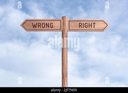 Wrong or Right concept. Words in opposite directions on signpost with ...