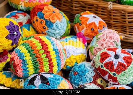Set of colorful handmade Easter eggs in a basket, group of handcrafted traditional Polish pisanki, group of objects detail, closeup, nobody, Easter ho Stock Photo