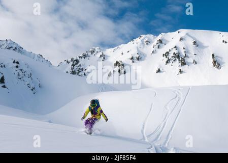 powder turn in the Austria Alps with a Splitboard  Stock Photo