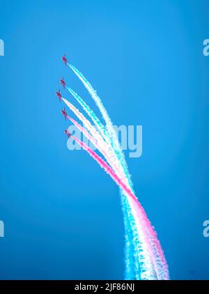 Red Arrows RAF aerobatic team and beautiful clear blue sky Stock Photo