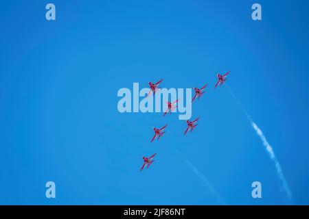 The Red Arrows RAF aerobatic team and beautiful clear blue sky Stock Photo