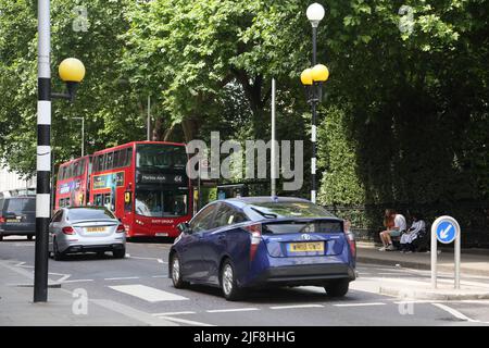 Traffic Driving Through Empty Pedestrian Crossing Fulham Road London England Stock Photo