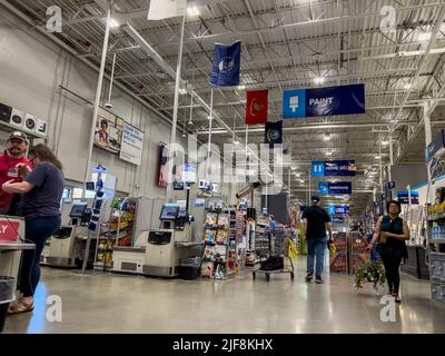 Mill Creek, WA USA - circa June 2022: Angled view of people shopping inside a Lowe's home improvement store. Stock Photo