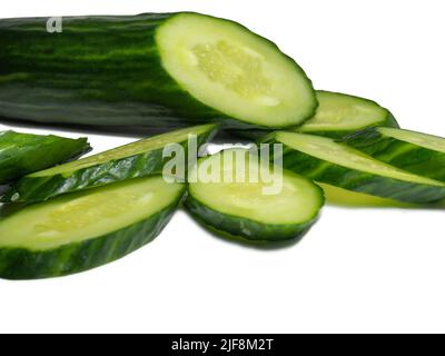 Smooth medium-sized cucumber on a white background. Cucumber slices, isolate. Sliced ​​vegetable. Vegetable isolate. Green Stock Photo
