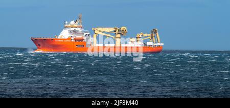 The Normand Clipper, operated by Global Marine, laying communications cables near Eday, Orkney Islands Stock Photo