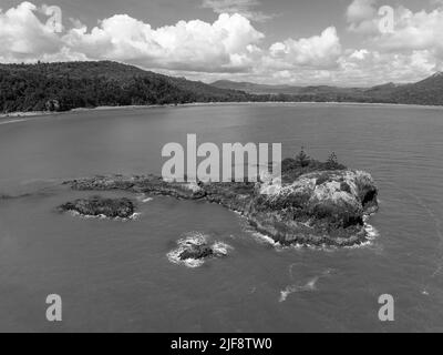 Wedge Island off the coast of Cape Hillsborough Australia rocky outcrop with two lone trees Stock Photo