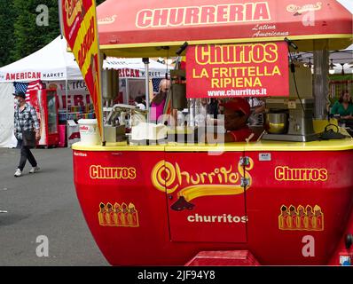 Sale of Churros at International Street Food Fair in Modena. Italy Stock Photo