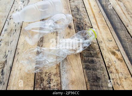 Plastic water bottles for recycle on the wooden table background Stock Photo