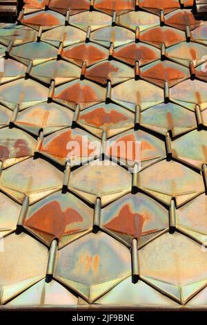 Roof covering made of galvanized steel. Colorful copper tile made of hexagon sheets. Stock Photo