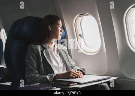 A Female Passenger Traveling by Plane Sleeping on Cushion Airplane Stock  Photo - Image of inside, person: 273342598