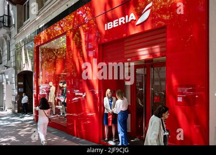 Madrid, Spain. 25th May, 2022. Pedestrians walk past the Spanish airline store Iberia in Spain. Credit: SOPA Images Limited/Alamy Live News Stock Photo