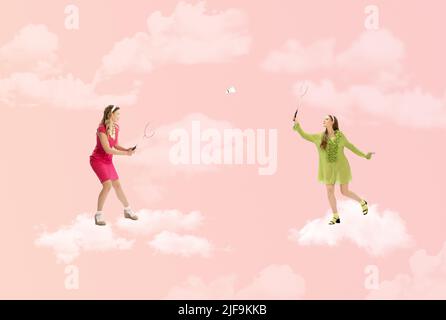 Contemporary art collage. Creative colorful design with two stylish girls playing badminton on clouds Stock Photo