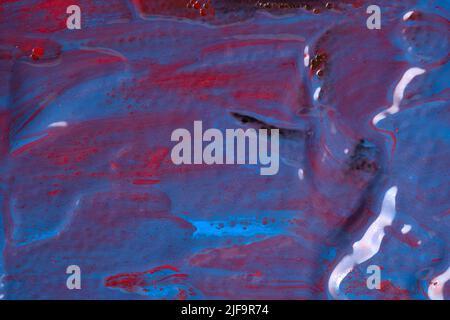 Wet red blue and purple violet wet paint texture. Abstract vibrant background banner Stock Photo