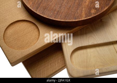A group of wooden chopping boards and a round tray found in the modern kitchen. Food prep boards. Stock Photo