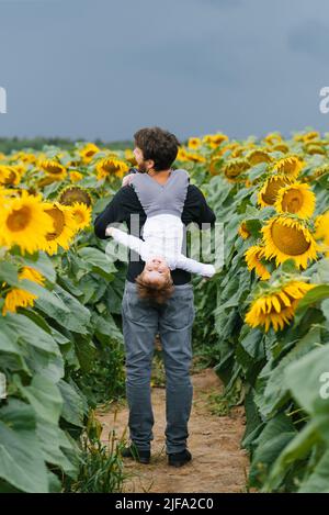 Senior Couple Walking Through A Flower Garden Stock Photo - Alamy