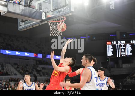 Melbourne, Australia. 1st July, 2022. Zhu Junlong (2nd L) of China competes during the Group B match between China and Chinese Taipei of Basketball World Cup Asian Qualifiers in Melbourne, Australia, July 1, 2022. Credit: Bai Xue/Xinhua/Alamy Live News Stock Photo