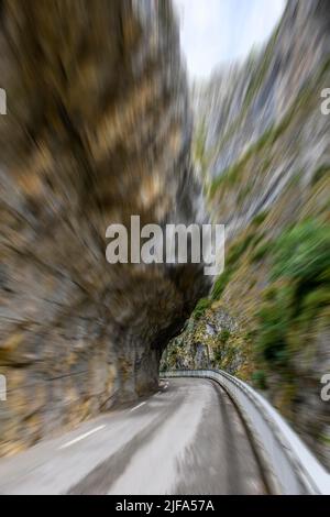View at high speed through windscreen of car during rally in curve of gorge Clue de St-Auban, balcony road, Saint Auban, Departement Stock Photo