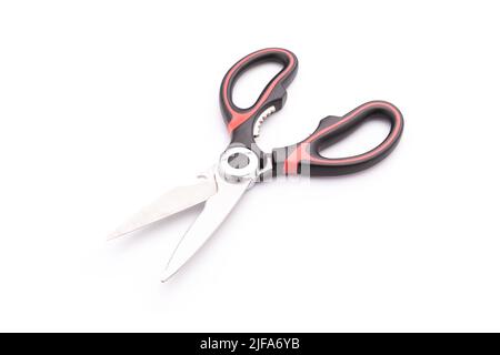 New scissor with red and black color on handle isolated on white background Stock Photo