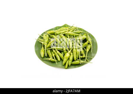 pile of green Bird Chilli or Thai pepper isolated on white background Stock Photo