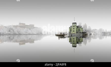 Snowfall and fog at the Helmovsky Jez hydroelectric power plant power station in Prague, Czech Republic Stock Photo