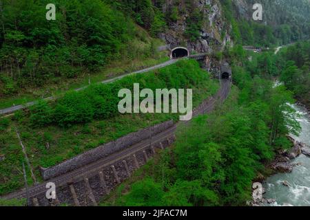 Drone aerial view of wild river Enns in cloudy weather in Gesause National Park near town of Admont in centre Austria. Visible long valley, clear blue Stock Photo