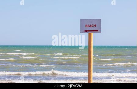 The inscription on the plate indicating in which direction the beach Stock Photo