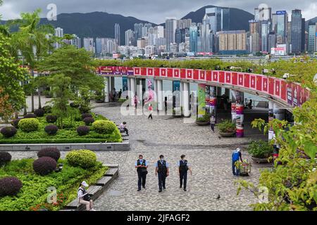 Hong Kong, China. 01st July, 2022. Police officers patrol in front of Hong Kong Bay during the anniversary ceremony. Hong Kong celebrates with great fanfare the 25th anniversary of the recession in the presence of the Chinese president. Credit: SOPA Images Limited/Alamy Live News Stock Photo