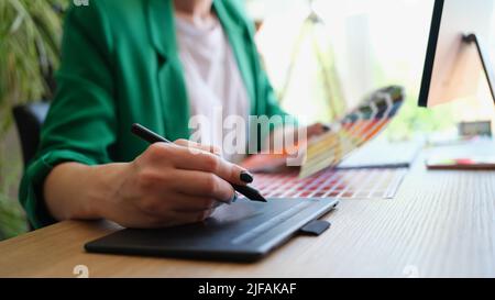 Professional female interior designer or graphic designer working on project Stock Photo
