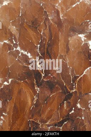 A vertical close-up orange-colored marble stone pattern great match for background and design Stock Photo