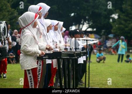 some students are practicing marching band with various musical instruments Stock Photo