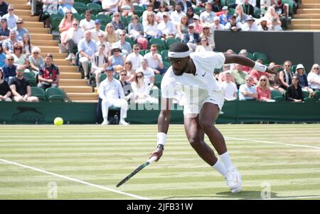 London, UK. 01st July, 2022. American Frances Tiafoe in action in his third round match against Kazakhstan's Alexander Bublik on day five of the 2022 Wimbledon championships in London on Friday, July 01, 2022. Tiafoe won the match 3-6, 7-6, 7-6, 6-4. Photo by Hugo Philpott/UPI Credit: UPI/Alamy Live News Stock Photo