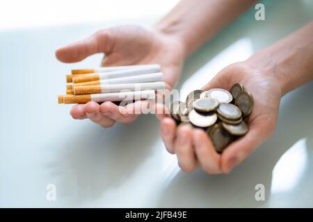 Cigarette Smoking Cost And Budget Money Loss With Tobacco Addiction Stock Photo