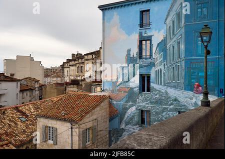 France, Charente, Angouleme, Boulevard Pasteur in the historic center, La fille des Remparts, painted wall from an original drawing by Max Cabanes and made by the Cité de la Création in 2004 Stock Photo