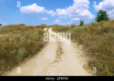 Road leading to the clouds Stock Photo